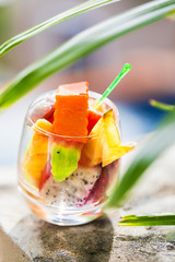 Glass of tropical exotic fruits salad