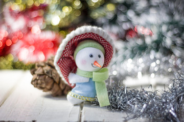 Christmas symbol - happy snowman in a red hat.
