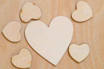 Obraz premium wooden hearts shape on wood background
