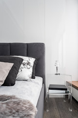 Bed and transparent side table