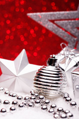 Christmas composition of Christmas tree toys on a red background