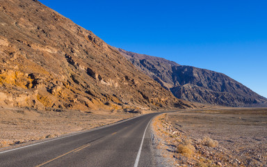 Scenery route through Death Valley National Park - lonesome road in the desert