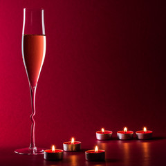 Valentine mood with a glass of champage and candles - 182741966