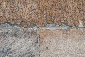 cracks in old stone blocks, chipped paint, beige texture, background
