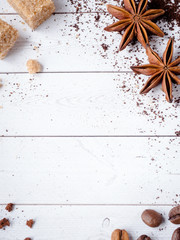 Background with different coffee, coffee bean, earth, and instantly, chocolate, brown sugar and star anise, copy space, top view.