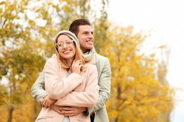 Fototapeta premium Young couple in park on autumn day