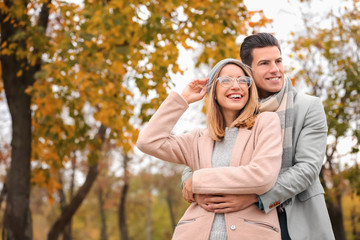 Fototapeta premium Young couple in park on autumn day