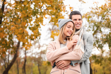 Young couple in park on autumn day