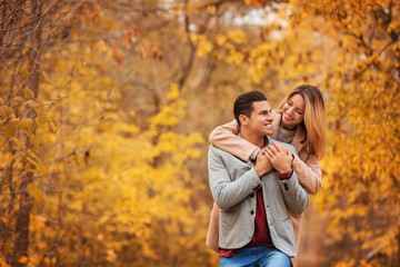 Young couple in park on autumn day