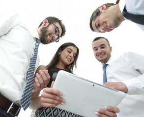 closeup of business team looking at digital tablet.