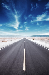 Naklejka premium Death Valley desert road, travel concept, color toned picture, USA.