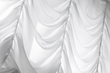 White waving tulle curtain. Background