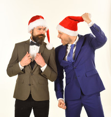 Colleagues with beards argue about business. Christmas celebration