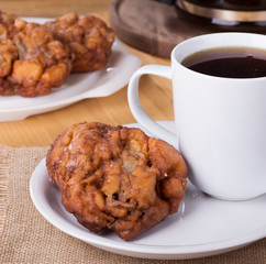 Glazed Apple Fritter and Cup of Coffee