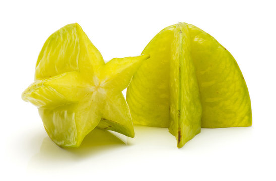 Carambola cut in half isolated on white background two halves.