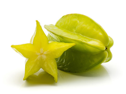 One whole carambola and one half isolated on white background.