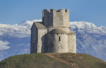 Church St. Nicholas near Nin on the prehistoric mound with snowy mountain Velebit in background, Croatia