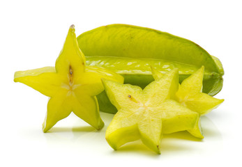 Fototapeta premium Sliced carambola isolated on white background three star slices and one whole.