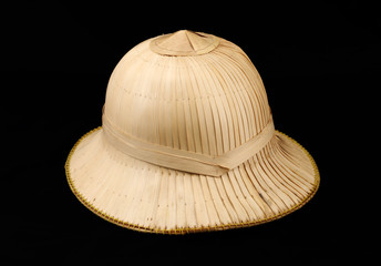 Old safari style tropical hat on isolated black background