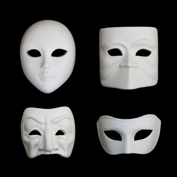 Set of four white venetian carnival masks on black backgound, set 1
