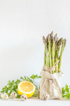 Fresh vegetables and asparagus in a little sack