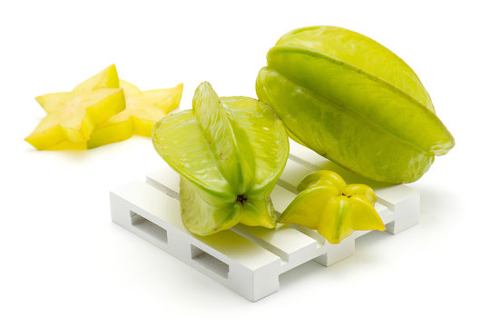 Carambola composition on a pallet isolated on white background.