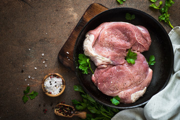 Raw pork meat in the pan. Top view copy space.