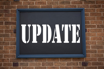 Obraz premium Conceptual hand writing text caption inspiration showing announcement Update. Business concept for Education Text knowledge study written on frame old brick background with copy space