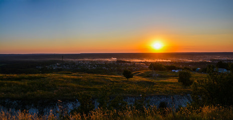 Panorama - summer sunset over the city.