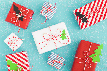 Fototapeta premium Cute Christmas gift boxes flat lay. Christmas concept.