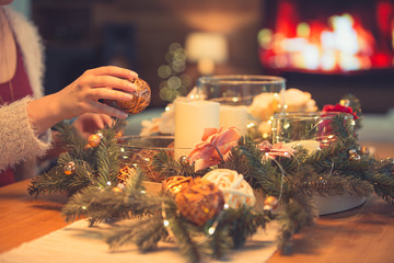 Woman decorating christmas table