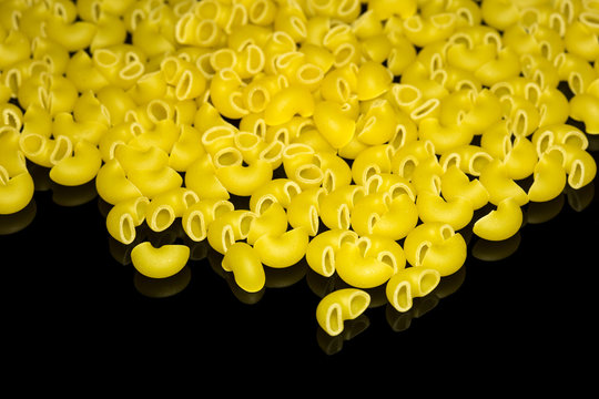 Lumache pasta isolated on black