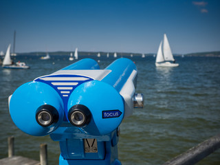 binoculars with boats in the background