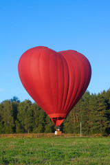 Red Valentine Heart shaped balloon flying