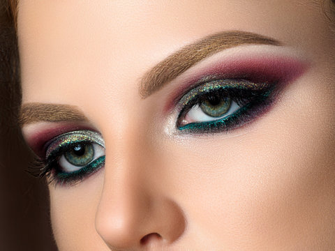 Close up of blue woman eyes with fashion makeup