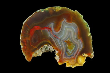 A cross section of the agate stone. Multicolored silica rings colored with metal oxides are...