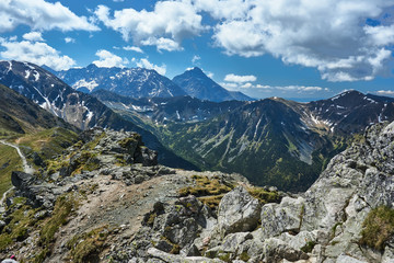 Fototapeta na wymiar Rocky peaks and clouded sky in the Tatra Mountains in Poland.