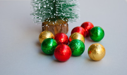 Christmas tree with sweet balls in macro. Xmas greeting card with space for text.