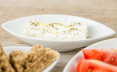 Greek Appetizers feta, tomatoes and rusks. Mediterranean traditional healthy food.