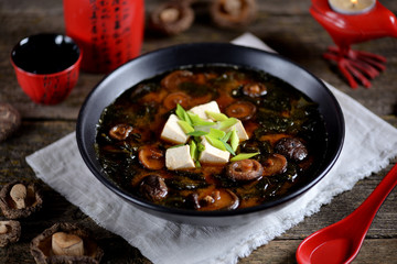 Miso soup with shiitake mushrooms, wakame seaweed, tofu cheese and dashi broth.