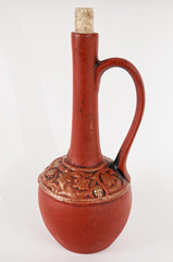Clay pitcher for wine on white background. - obrazy, fototapety, plakaty