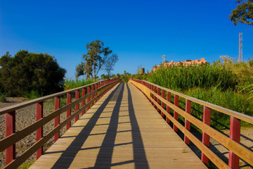 Fototapeta premium Road. Coastal wooden road. Costa del Sol, Andalusia, Spain.