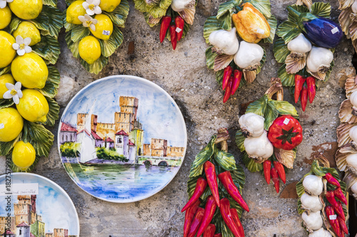 Hand Painted Plate With The Castello Scaligero In Sirmione Italy Hand Painted Plate With The Castello Scaligero In Sirmione Italy Hanging On A Wall