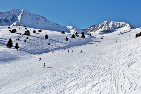 The ski slope with figures of skiers