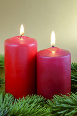 Christmas composition with two red candles.