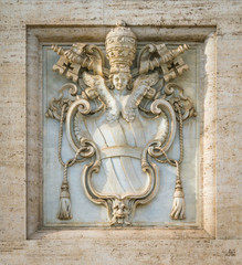 The arms of the Holy See under sede vacante, on the facade of the Basilica of Saint John Lateran in Rome, Italy.