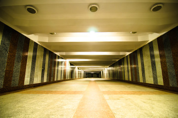 underground passage with lights on without people at night