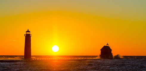 A late November sunset behind the Grand Haven, Michigan, lighthouse and pier