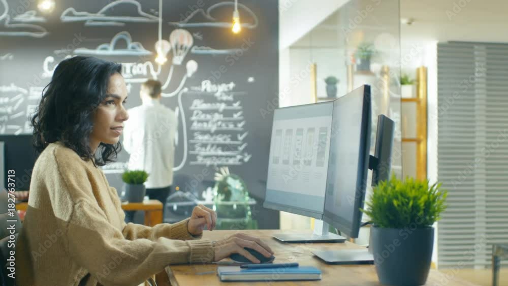 Poster Beautiful Woman Mobile Game Application Developer Works on a Personal Computer, Designing Wireframe. Shot on RED EPIC-W 8K Helium Cinema Camera.