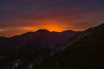 Sunsetting Behind California Mountain